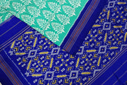 Ikat pure silk saree in green in  floral pattern with contrast pallu