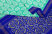 Ikat pure silk saree in green in  floral pattern with contrast pallu