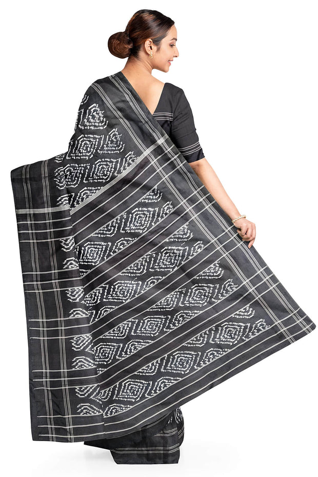 Handwoven ikat pure silk saree in black in  loop pattern  with silk borders