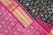 Handwoven ikat pure silk saree in black in navratan pattern