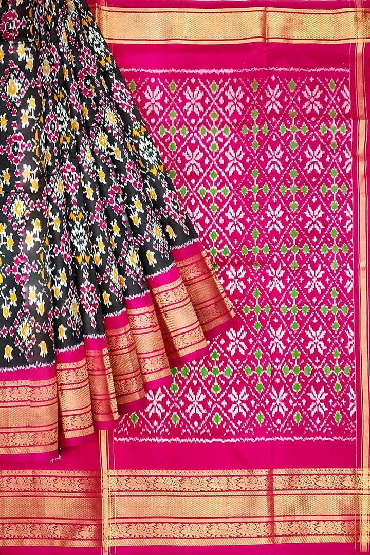Handwoven ikat pure silk saree in black in navratan pattern