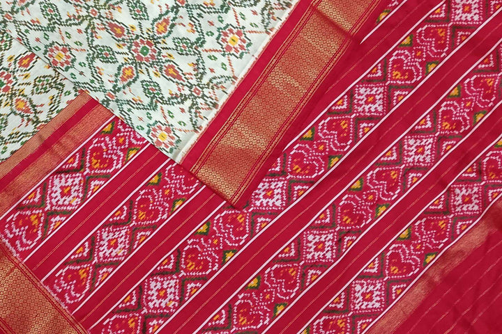 Handwoven ikat pure silk saree in off white in pan bhat pattern