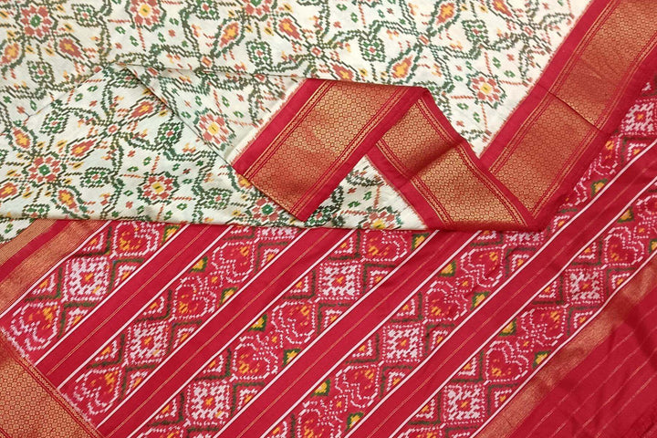 Handwoven ikat pure silk saree in off white in pan bhat pattern