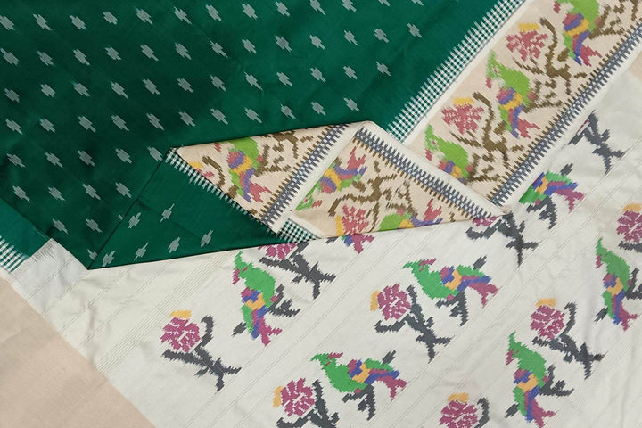 Handwoven ikat pure silk saree in dark green with small motifs