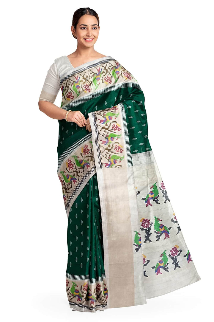 Handwoven ikat pure silk saree in dark green with small motifs