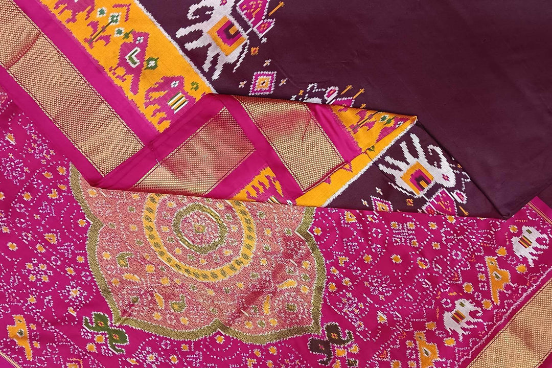 Handwoven Ikat pure silk saree in  dark wine  with elephant & bird motifs in skirt border . .