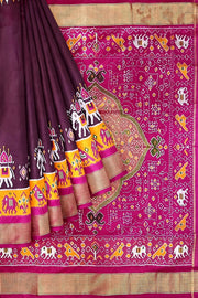Handwoven Ikat pure silk saree in  dark wine  with elephant & bird motifs in skirt border . .