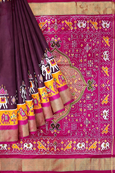 Handwoven Ikat pure silk saree in  dark wine  with elephant & bird motifs in skirt border . .