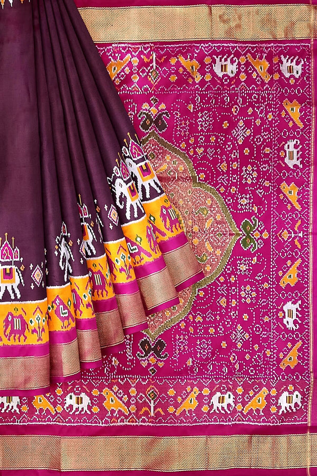 Handwoven Ikat pure silk saree in  dark wine  with elephant & bird motifs in skirt border . .