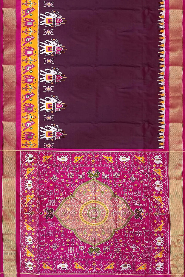 Handwoven Ikat pure silk saree in  dark wine  with elephant & bird motifs in skirt border . .