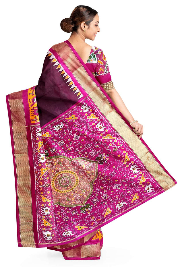 Handwoven Ikat pure silk saree in  dark wine  with elephant & bird motifs in skirt border . .