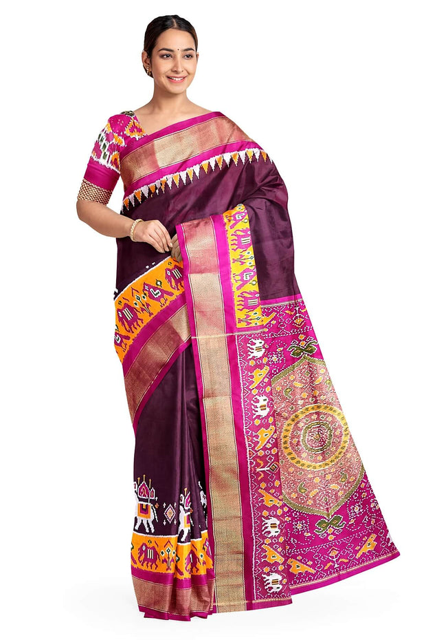 Handwoven Ikat pure silk saree in  dark wine  with elephant & bird motifs in skirt border . .