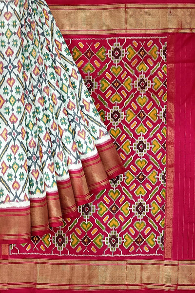 Handwoven ikat pure silk saree in off white in pan bhat pattern