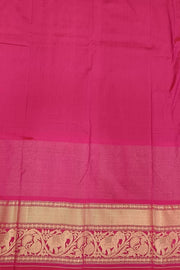 A peacock blue ikat pure silk saree in narikunj pattern with elephant motifs in skirt border.