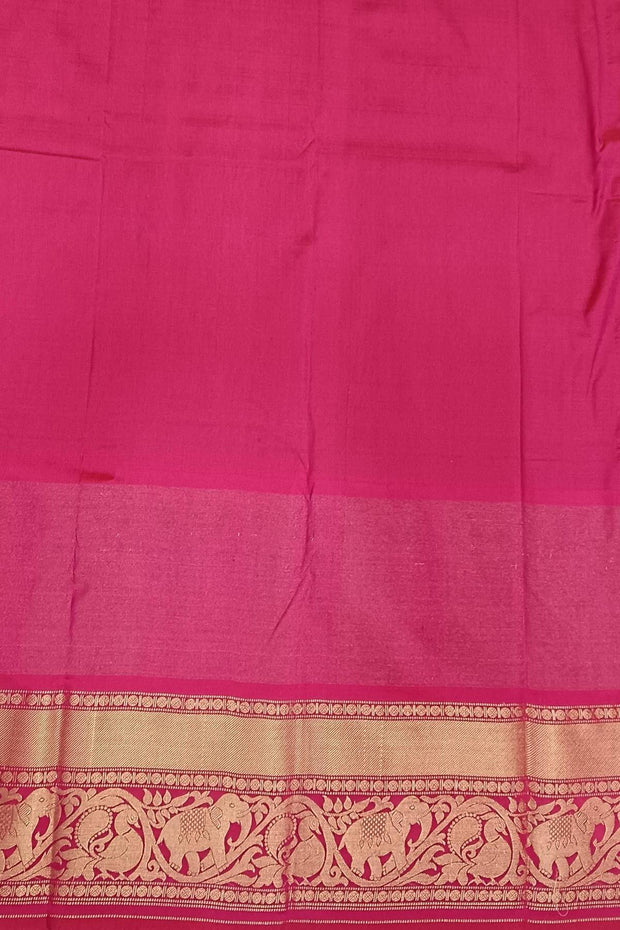 A peacock blue ikat pure silk saree in narikunj pattern with elephant motifs in skirt border.