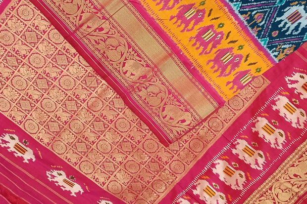 A peacock blue ikat pure silk saree in narikunj pattern with elephant motifs in skirt border.