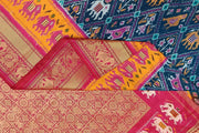 A peacock blue ikat pure silk saree in narikunj pattern with elephant motifs in skirt border.