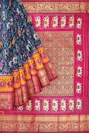 A peacock blue ikat pure silk saree in narikunj pattern with elephant motifs in skirt border.