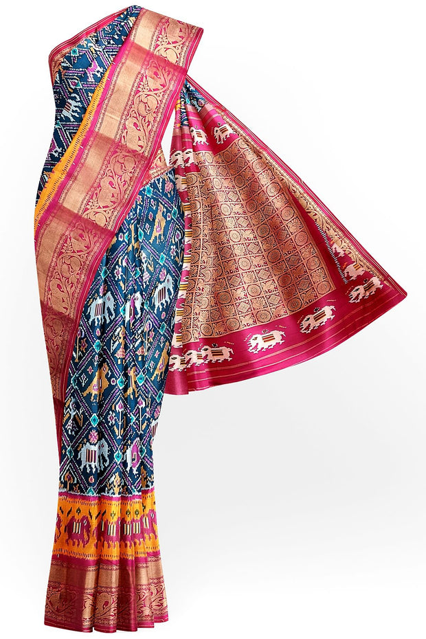A peacock blue ikat pure silk saree in narikunj pattern with elephant motifs in skirt border.