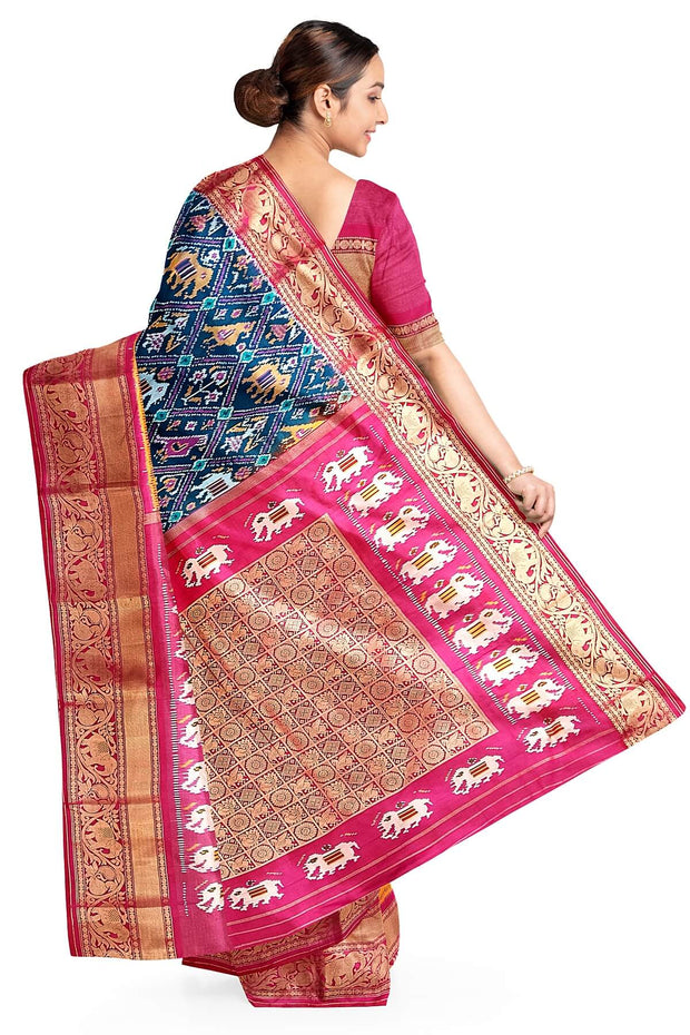 A peacock blue ikat pure silk saree in narikunj pattern with elephant motifs in skirt border.