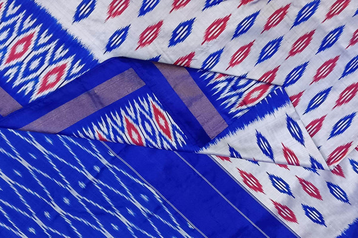 Handwoven ikat pure silk saree in silver with leaf motifs on the body