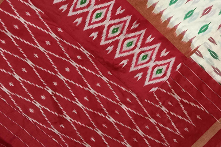 Handwoven ikat pure silk saree in  off white with leaf motifs on the body