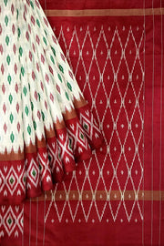 Handwoven ikat pure silk saree in  off white with leaf motifs on the body