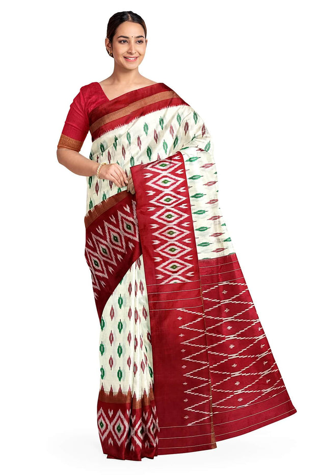 Handwoven ikat pure silk saree in  off white with leaf motifs on the body