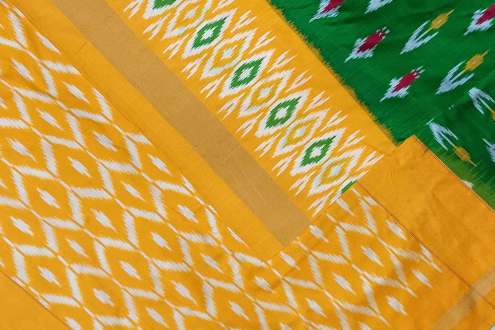 Handwoven ikat pure silk saree in green with anchor motifs on the body