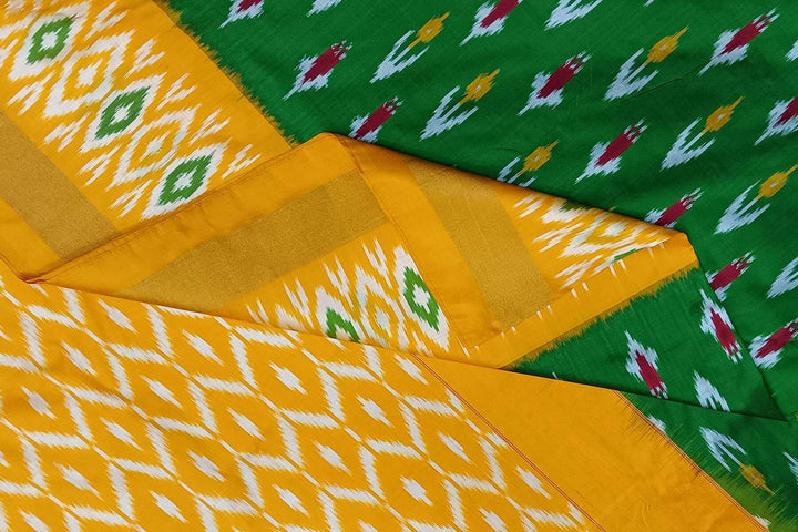 Handwoven ikat pure silk saree in green with anchor motifs on the body