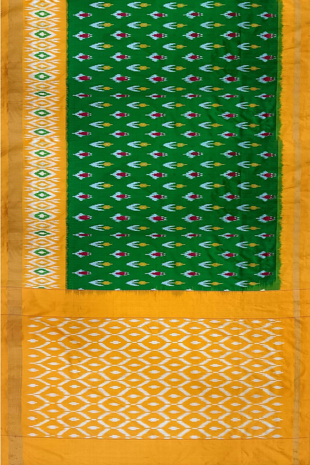 Handwoven ikat pure silk saree in green with anchor motifs on the body