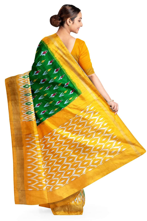 Handwoven ikat pure silk saree in green with anchor motifs on the body