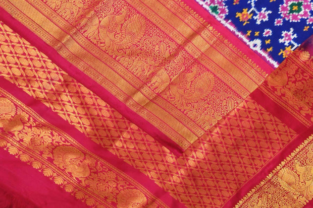 A blue colour  ikkat pure silk saree in navratan pattern .
