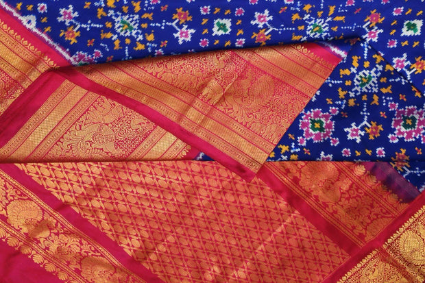 A blue colour  ikkat pure silk saree in navratan pattern .