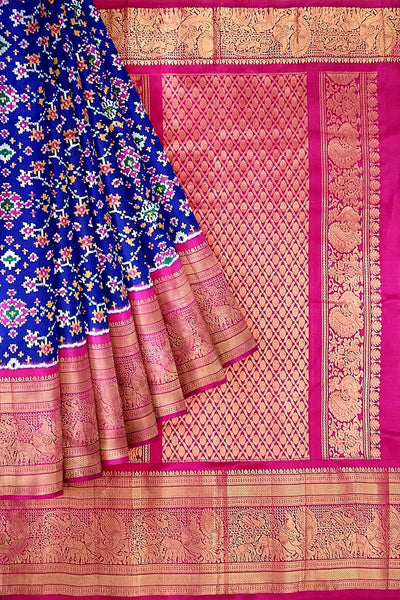 A blue colour  ikkat pure silk saree in navratan pattern .