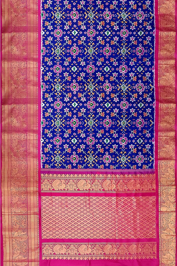 A blue colour  ikkat pure silk saree in navratan pattern .