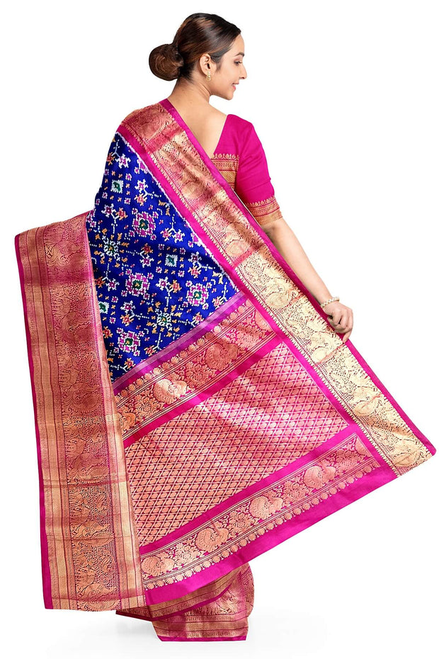 A blue colour  ikkat pure silk saree in navratan pattern .