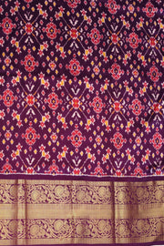An orange colour ikkat pure silk saree in narikunj  pattern .