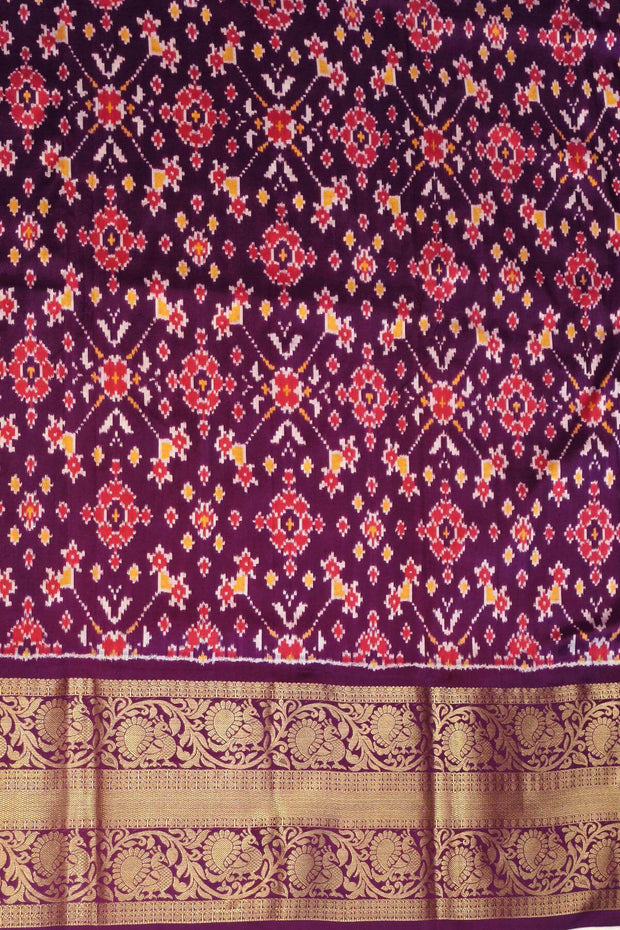 An orange colour ikkat pure silk saree in narikunj  pattern .