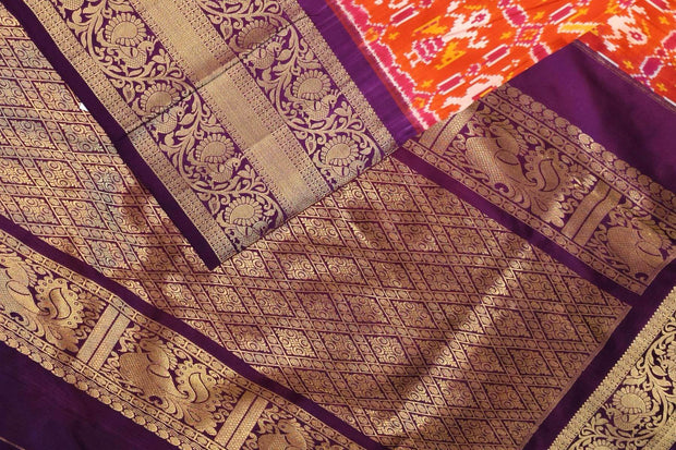 An orange colour ikkat pure silk saree in narikunj  pattern .