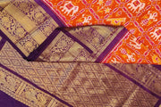 An orange colour ikkat pure silk saree in narikunj  pattern .