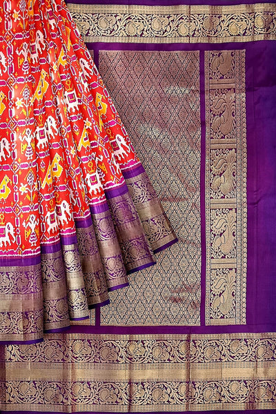 An orange colour ikkat pure silk saree in narikunj  pattern .