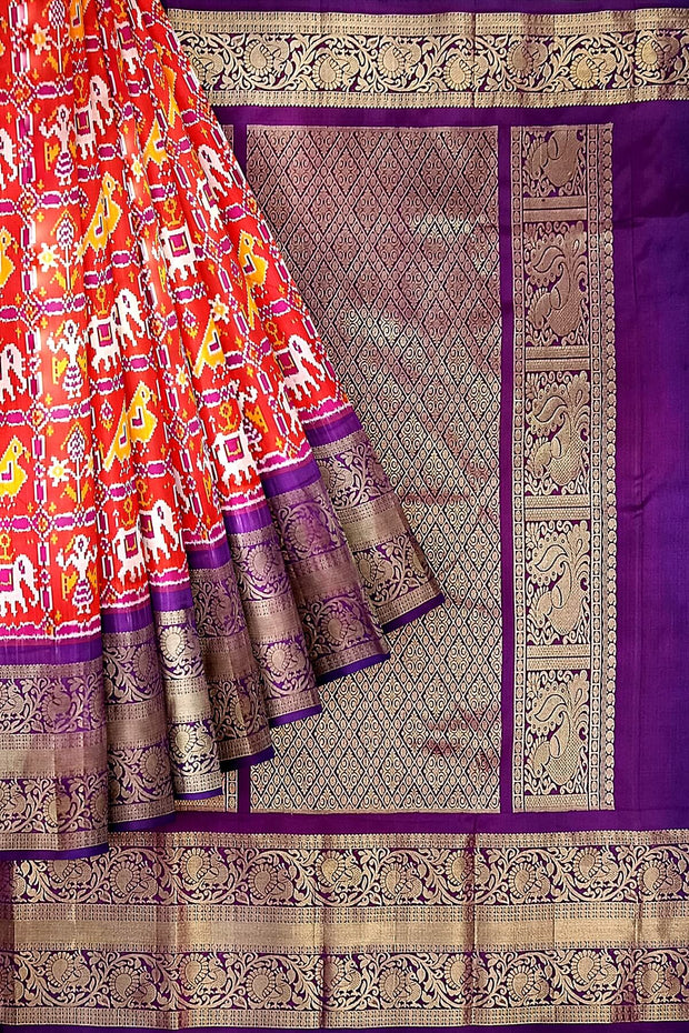 An orange colour ikkat pure silk saree in narikunj  pattern .