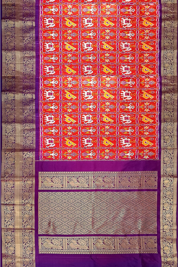 An orange colour ikkat pure silk saree in narikunj  pattern .