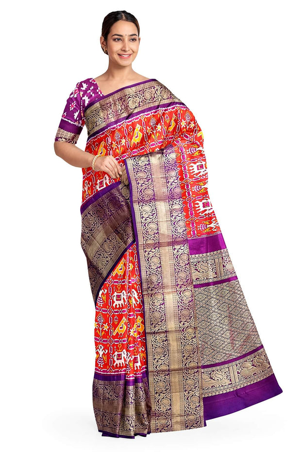 An orange colour ikkat pure silk saree in narikunj  pattern .