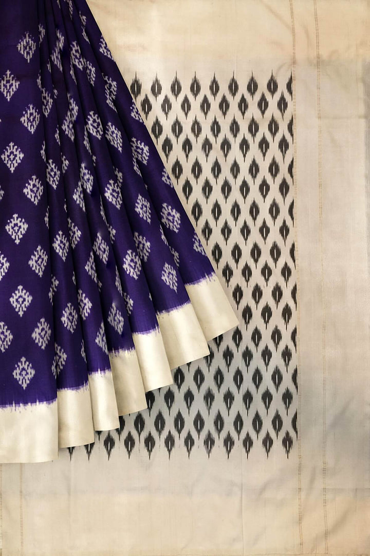Handwoven ikat pure silk saree in purple with diamond motifs