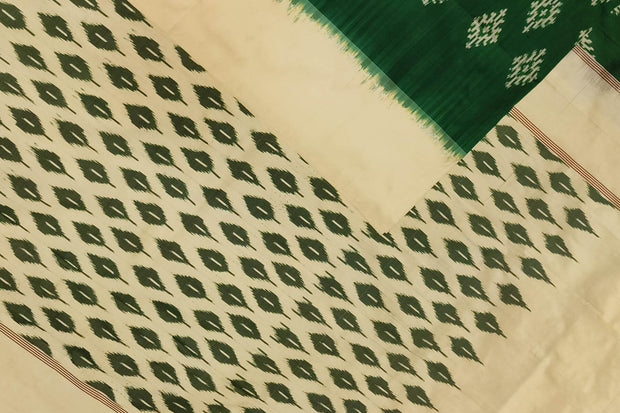 Handwoven ikat pure silk saree in green with diamond motifs