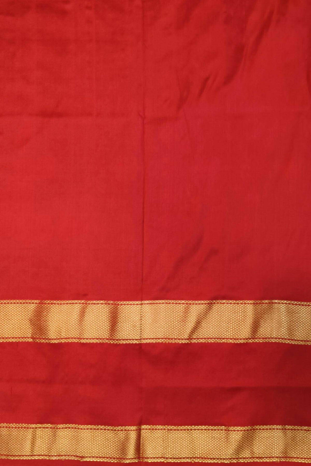 Ikkat pure silk saree in bottle green with a combo of navratan &  pan bhat pattern.