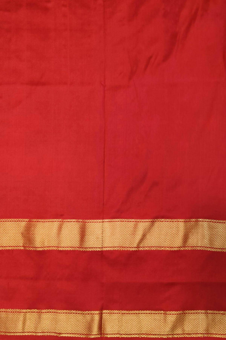 Ikkat pure silk saree in bottle green with a combo of navratan &  pan bhat pattern.