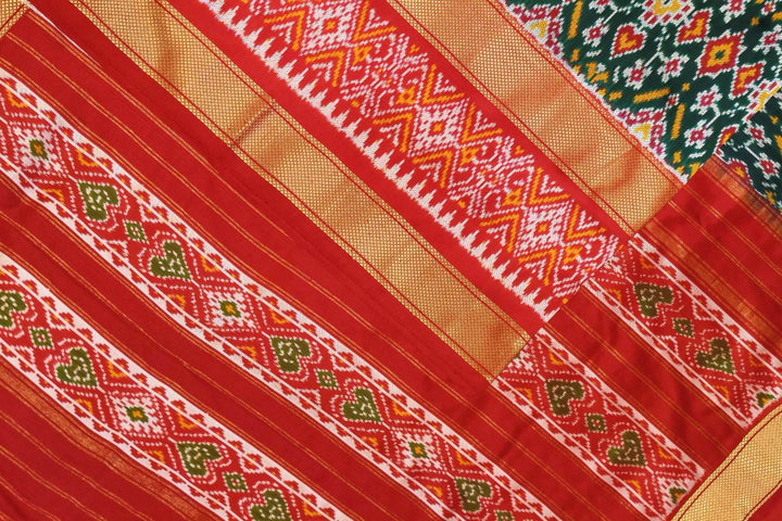 Ikkat pure silk saree in bottle green with a combo of navratan &  pan bhat pattern.